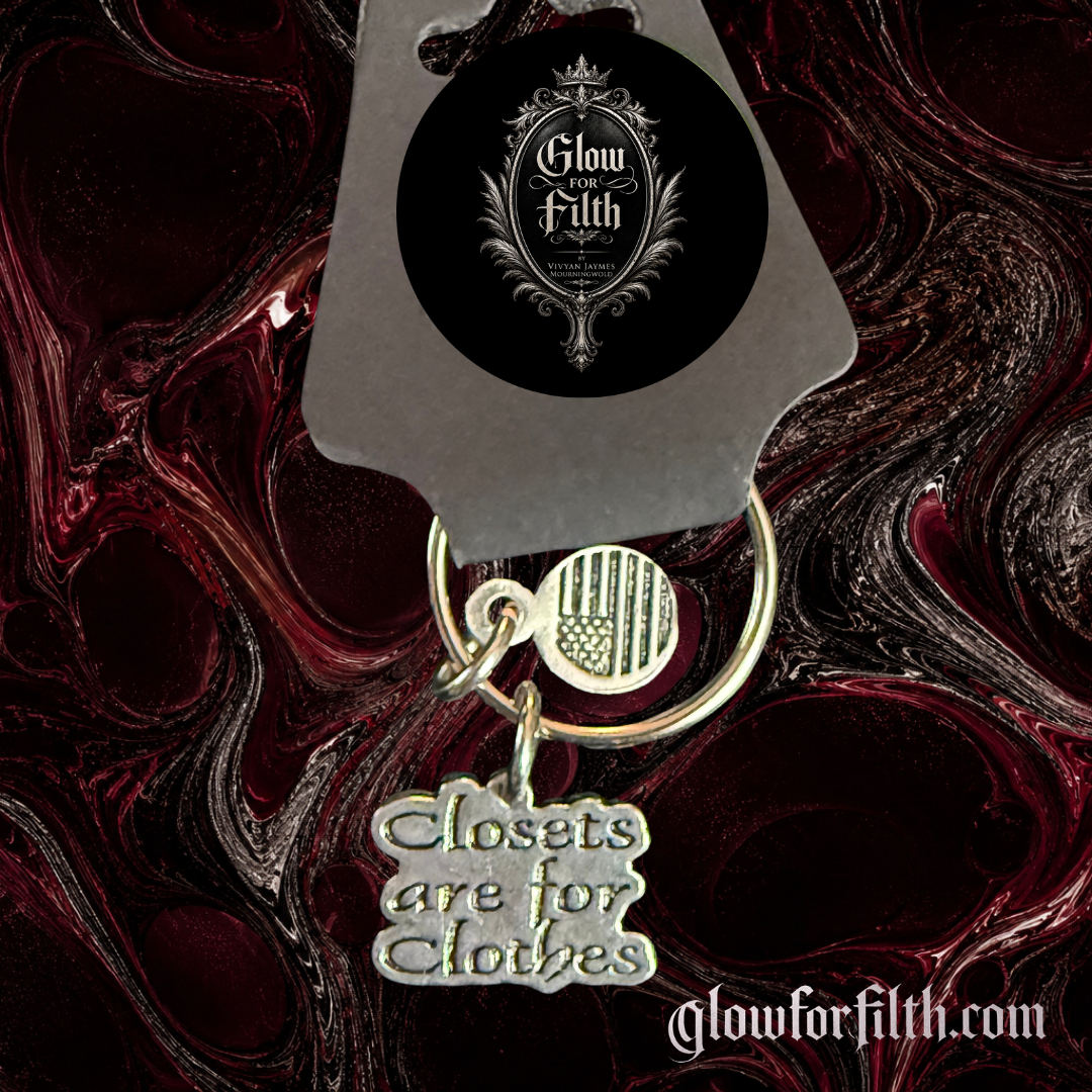 American pewter Closets Are For Clothes keychain with American flag accent charm displayed on Glow for Filth branded packaging.