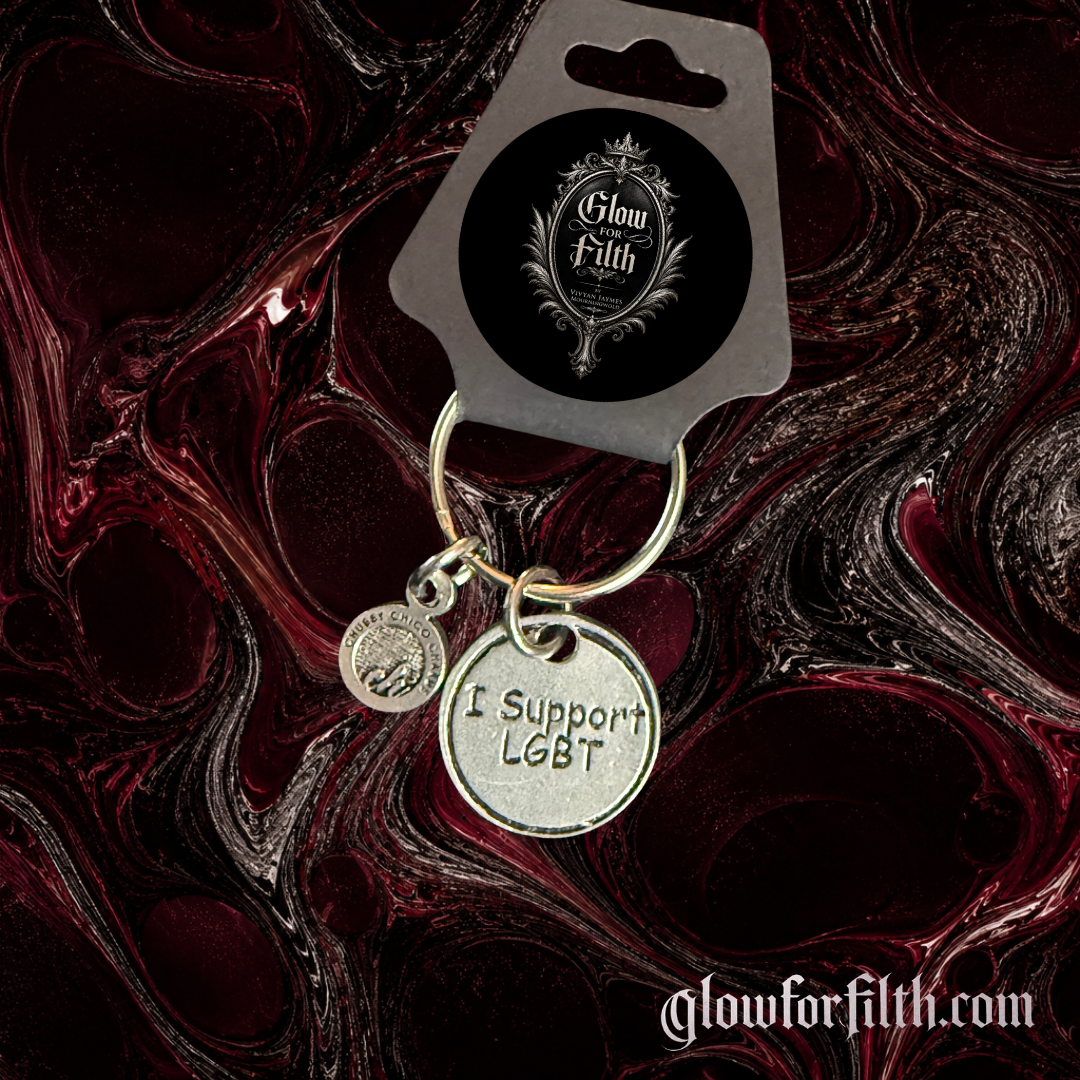 American pewter I Support LGBT keychain with silver-toned finish and accent charm displayed on Glow for Filth branded packaging.