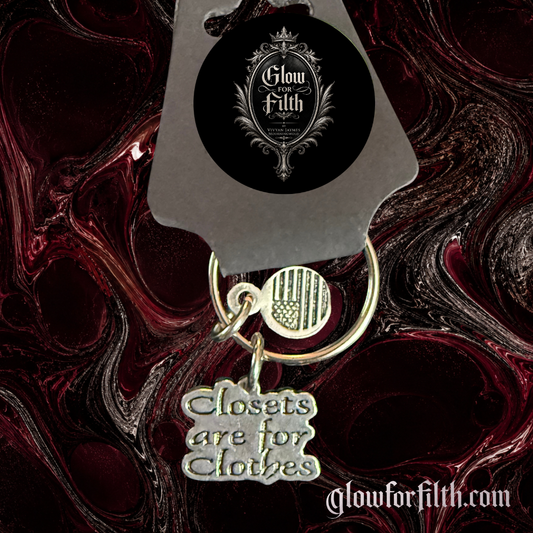 American pewter Closets Are For Clothes keychain with American flag accent charm displayed on Glow for Filth branded packaging.