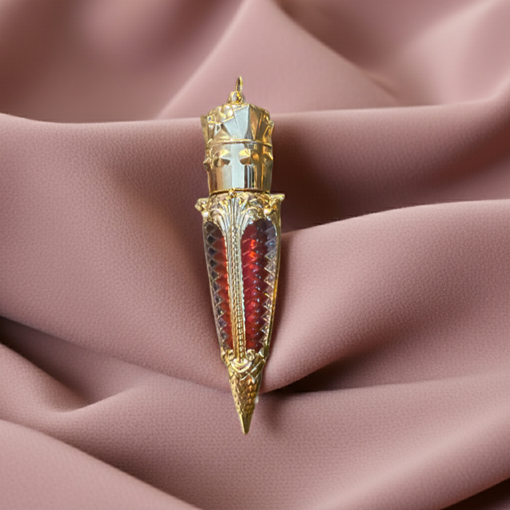 Luxury gothic red lip gloss in ornate gold claw tube displayed against soft blush fabric folds for an editorial beauty campaign aesthetic.