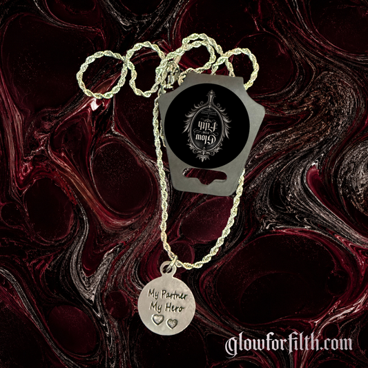 Silver-tone rope chain necklace featuring a lead-free pewter My Partner My Hero charm displayed on a burgundy and black gothic marbled background.